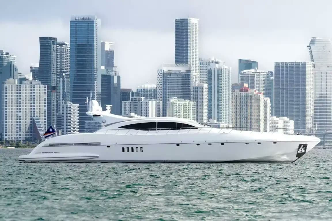 A flagship motor yacht on Biscayne Bay against the Miami skyline